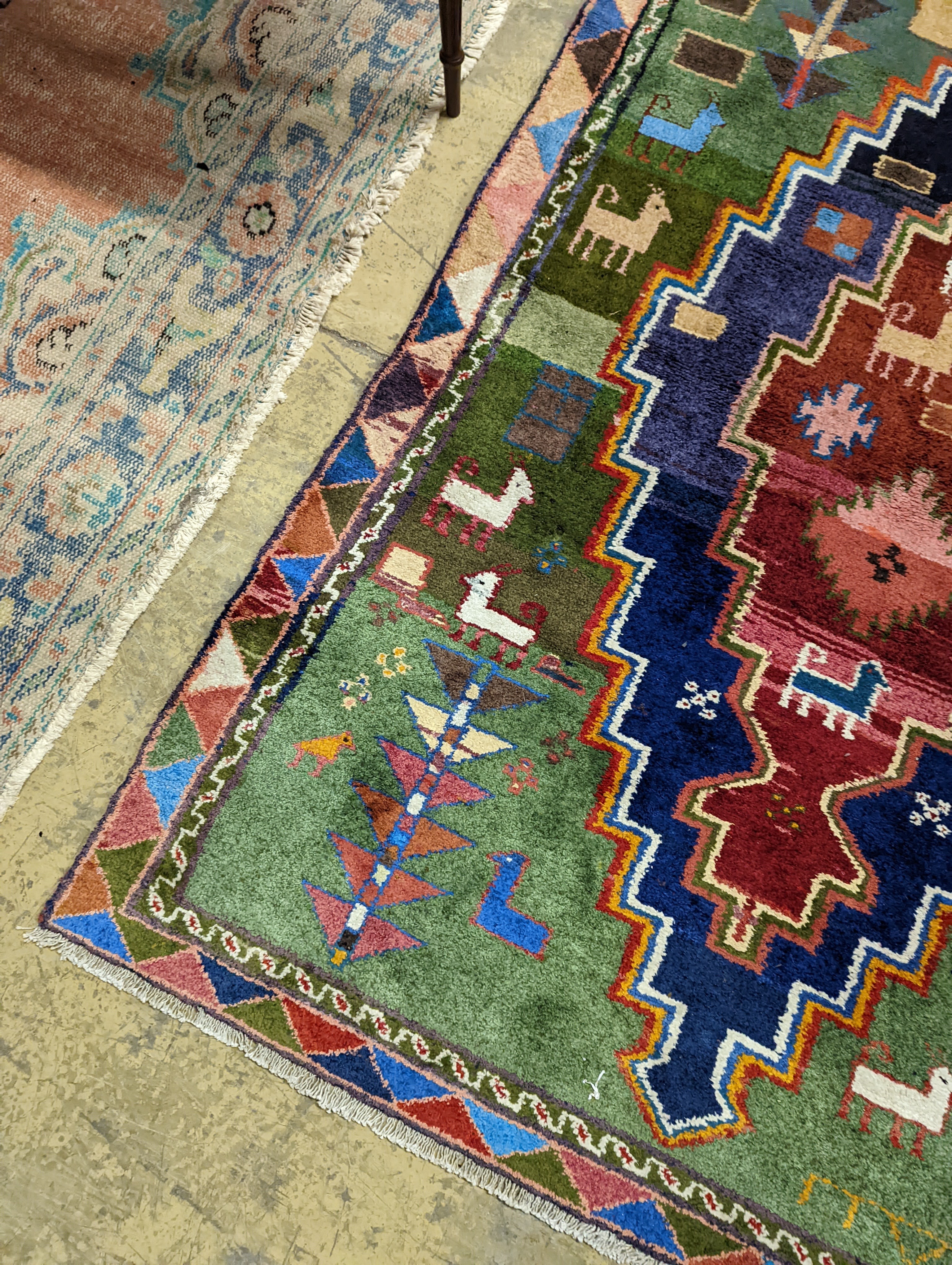 A Caucasian design blue ground rug, 180 x 128cm